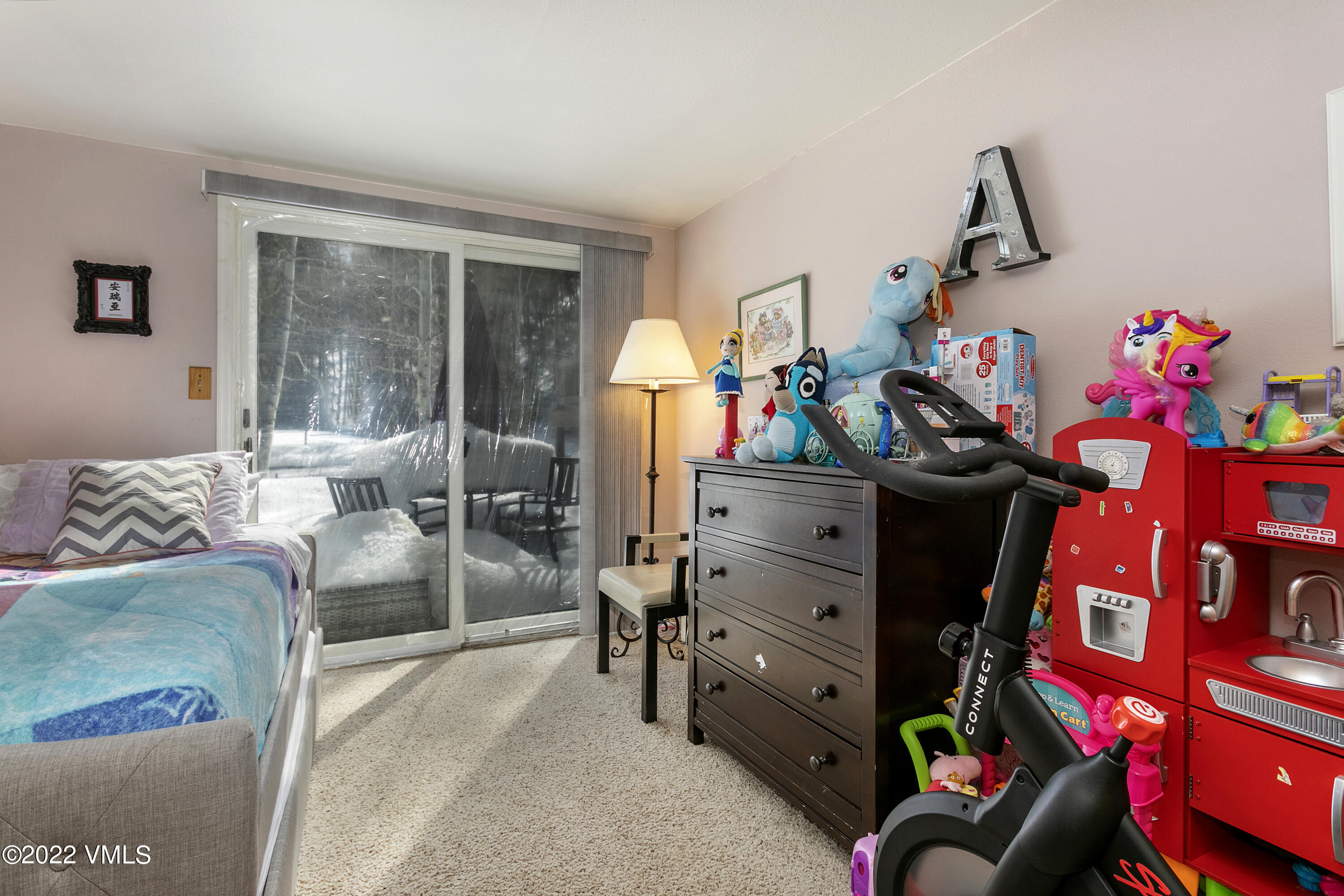 1614 Buffehr Creek Road, Unit A19 Vail, CO 81657 - Photo 14 of 23 a bedroom with furniture and a window