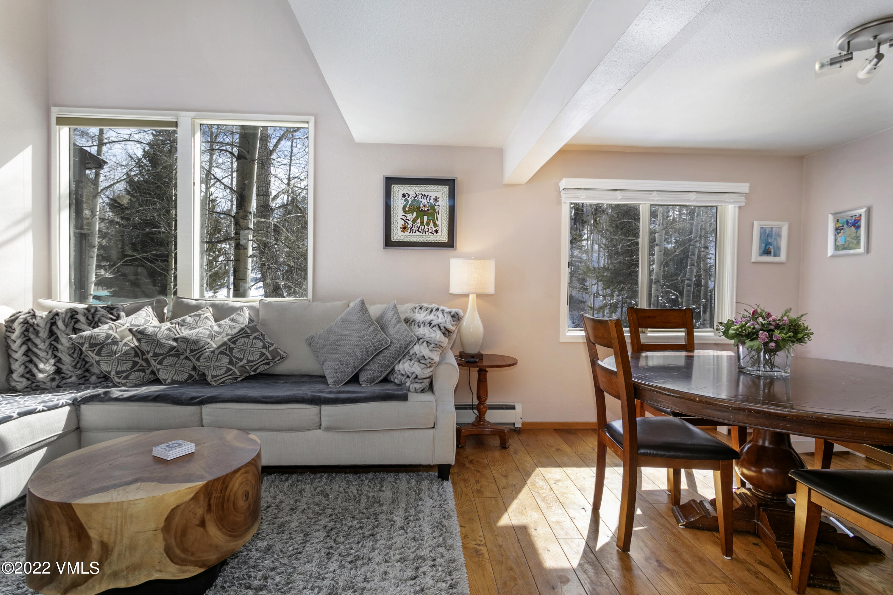 1614 Buffehr Creek Road, Unit A19 Vail, CO 81657 - Photo 7 of 23 a living room with furniture and a large window
