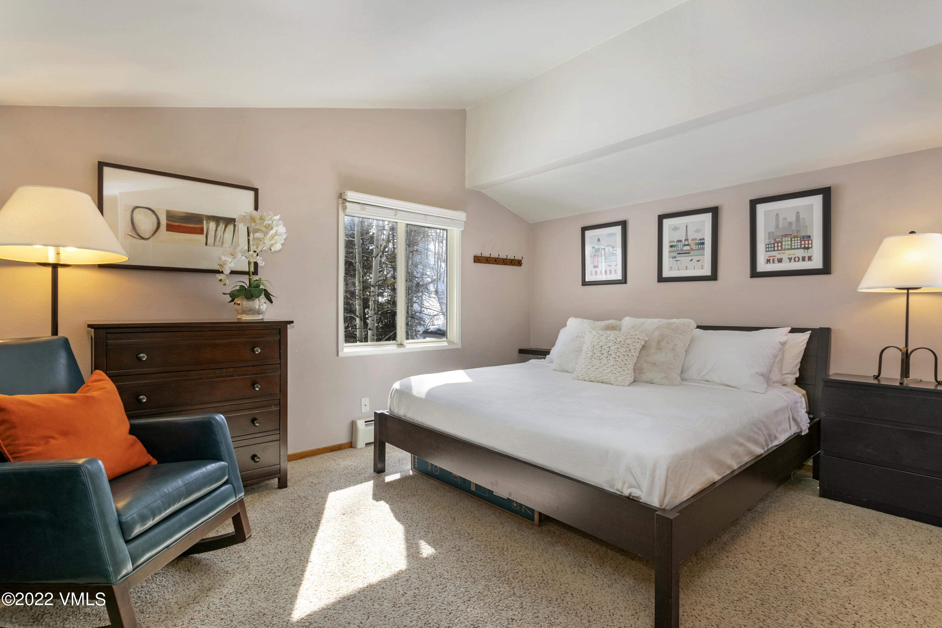 1614 Buffehr Creek Road, Unit A19 Vail, CO 81657 - Photo 10 of 23 a bedroom with a bed and a dresser