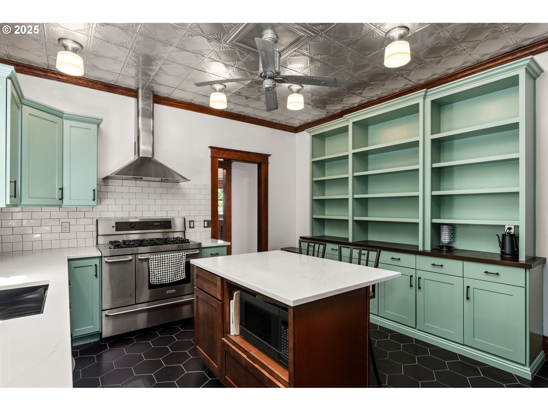 928 Southeast 18th Avenue Portland, OR 97214 - Photo 14 of 47 a kitchen with cabinets and stainless steel appliances