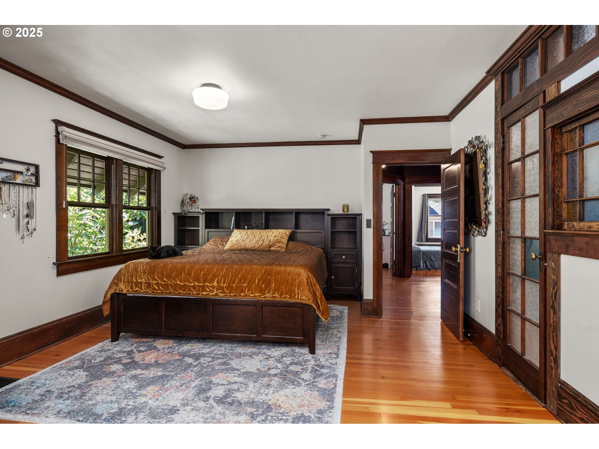 928 Southeast 18th Avenue Portland, OR 97214 - Photo 17 of 47 a bedroom with a large bed and a window