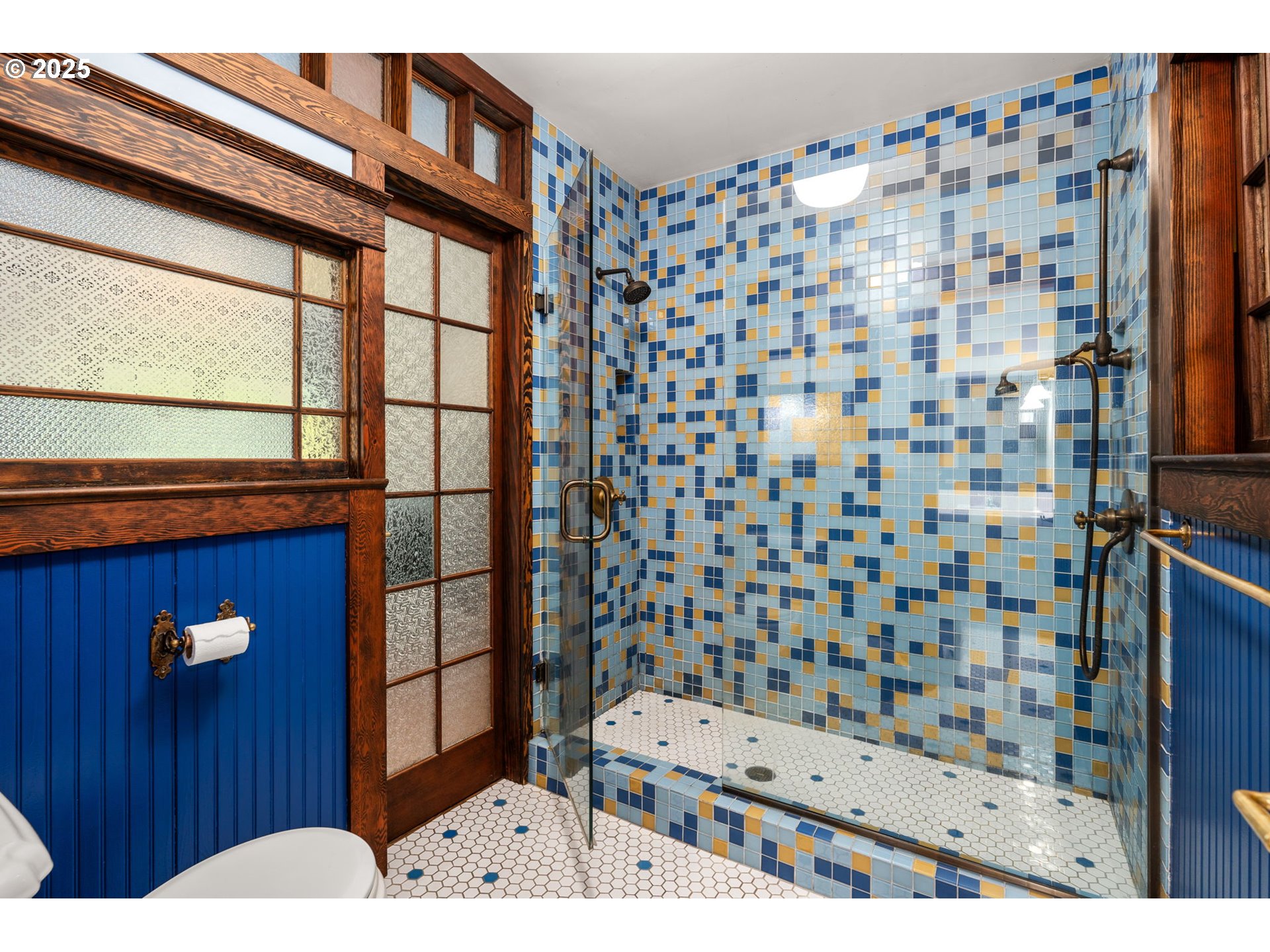 928 Southeast 18th Avenue Portland, OR 97214 - Photo 21 of 47 a bathroom with a sink a toilet and shower curtain