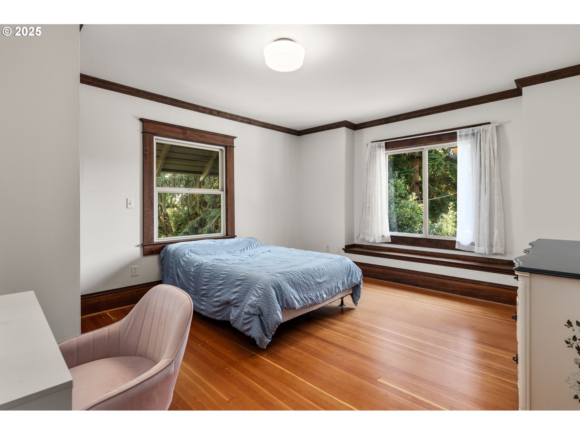 928 Southeast 18th Avenue Portland, OR 97214 - Photo 26 of 47 a bedroom with a bed and a large window