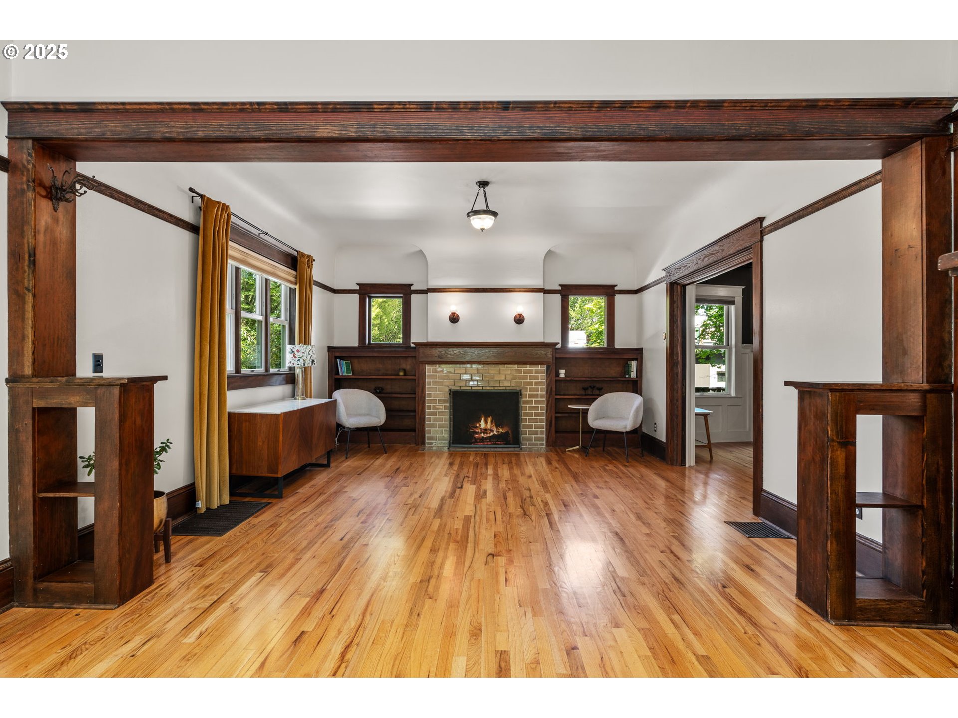 928 Southeast 18th Avenue Portland, OR 97214 - Photo 7 of 47 a living room with furniture and a fireplace