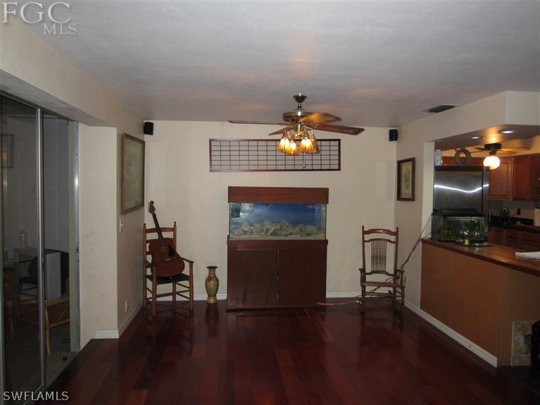 6197 Park Road Fort Myers, FL 33908 - Photo 5 of 11 a living room with furniture and a fireplace