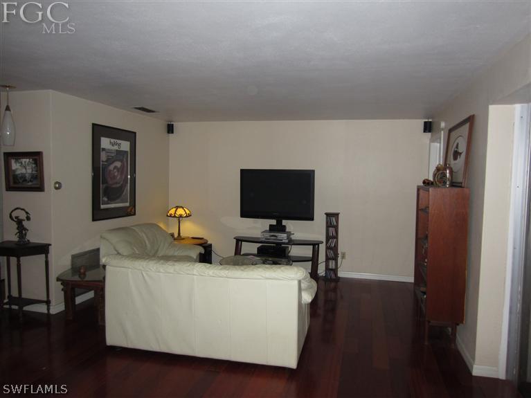 6197 Park Road Fort Myers, FL 33908 - Photo 8 of 11 a living room with furniture and a flat screen tv