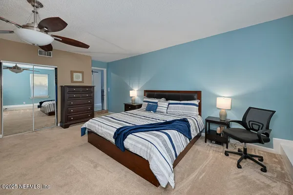 a bedroom with a bed and furniture