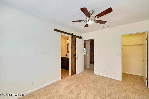 a view of a livingroom with a ceiling fan