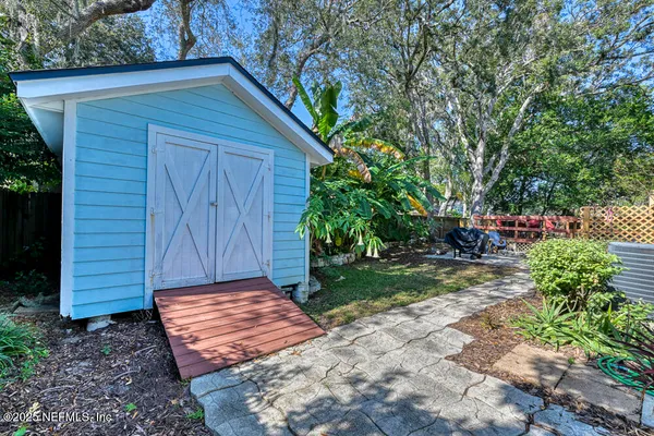 a view of a wooden door and a yard