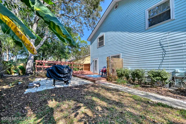 a view of a backyard with a sitting area and furniture