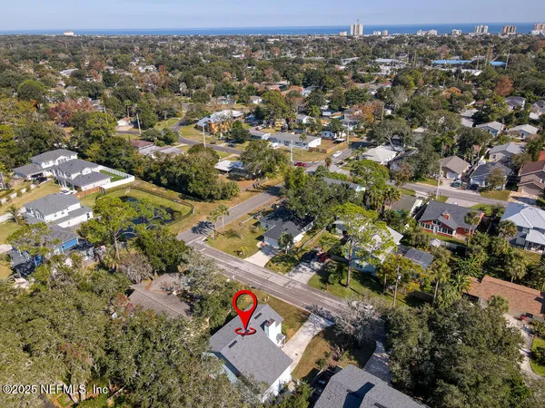an aerial view of residential houses with outdoor space