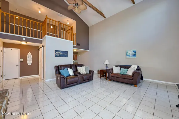 a living room with furniture and a table
