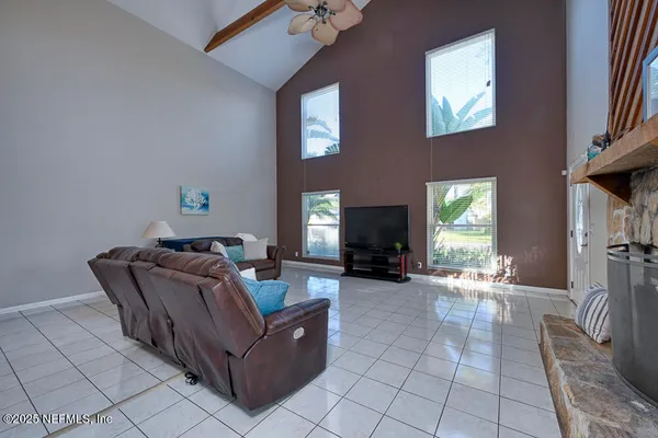 a living room with furniture and a fireplace