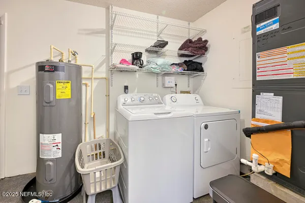 a utility room with sink dryer and washer