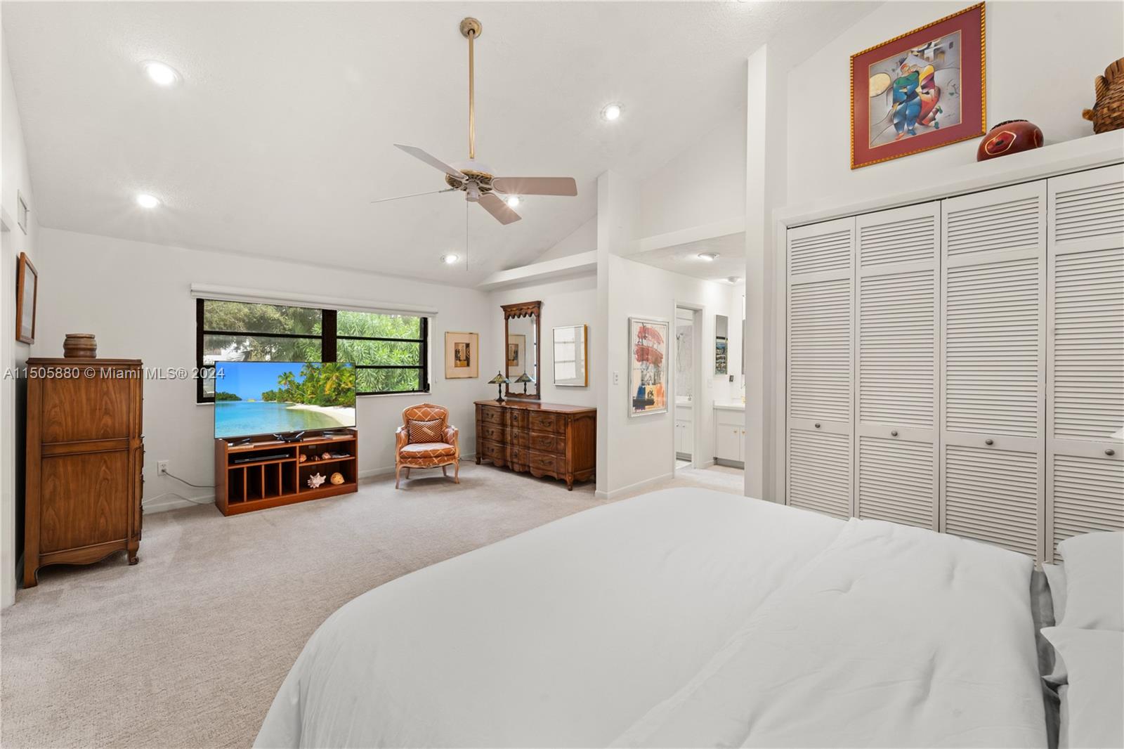 8636 Southwest 94th Street Miami, FL 33156 - Photo 16 of 29 a bedroom with furniture and a flat screen tv