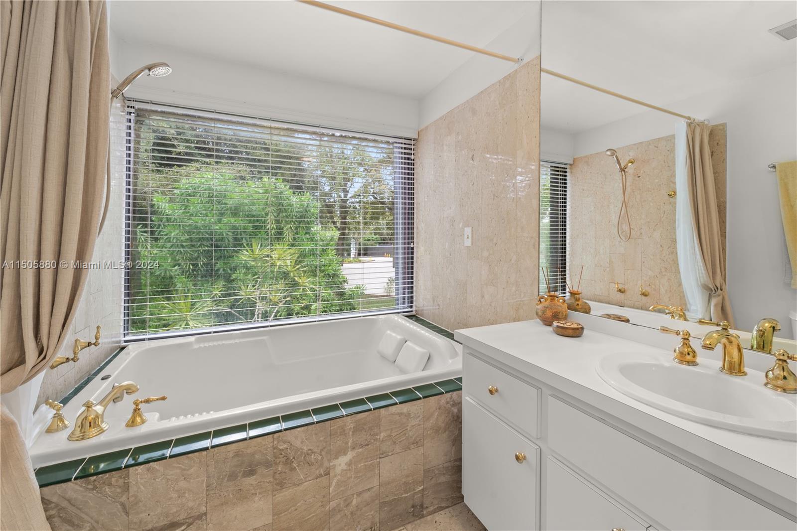 8636 Southwest 94th Street Miami, FL 33156 - Photo 18 of 29 a bathroom with a tub a sink and mirror