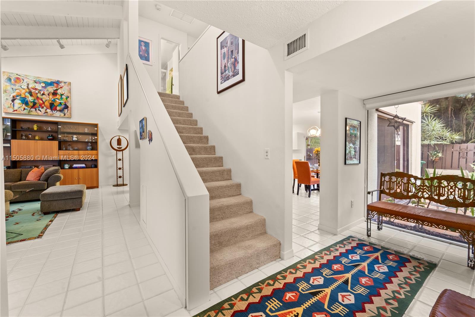 8636 Southwest 94th Street Miami, FL 33156 - Photo 4 of 29 a living room with furniture and a rug