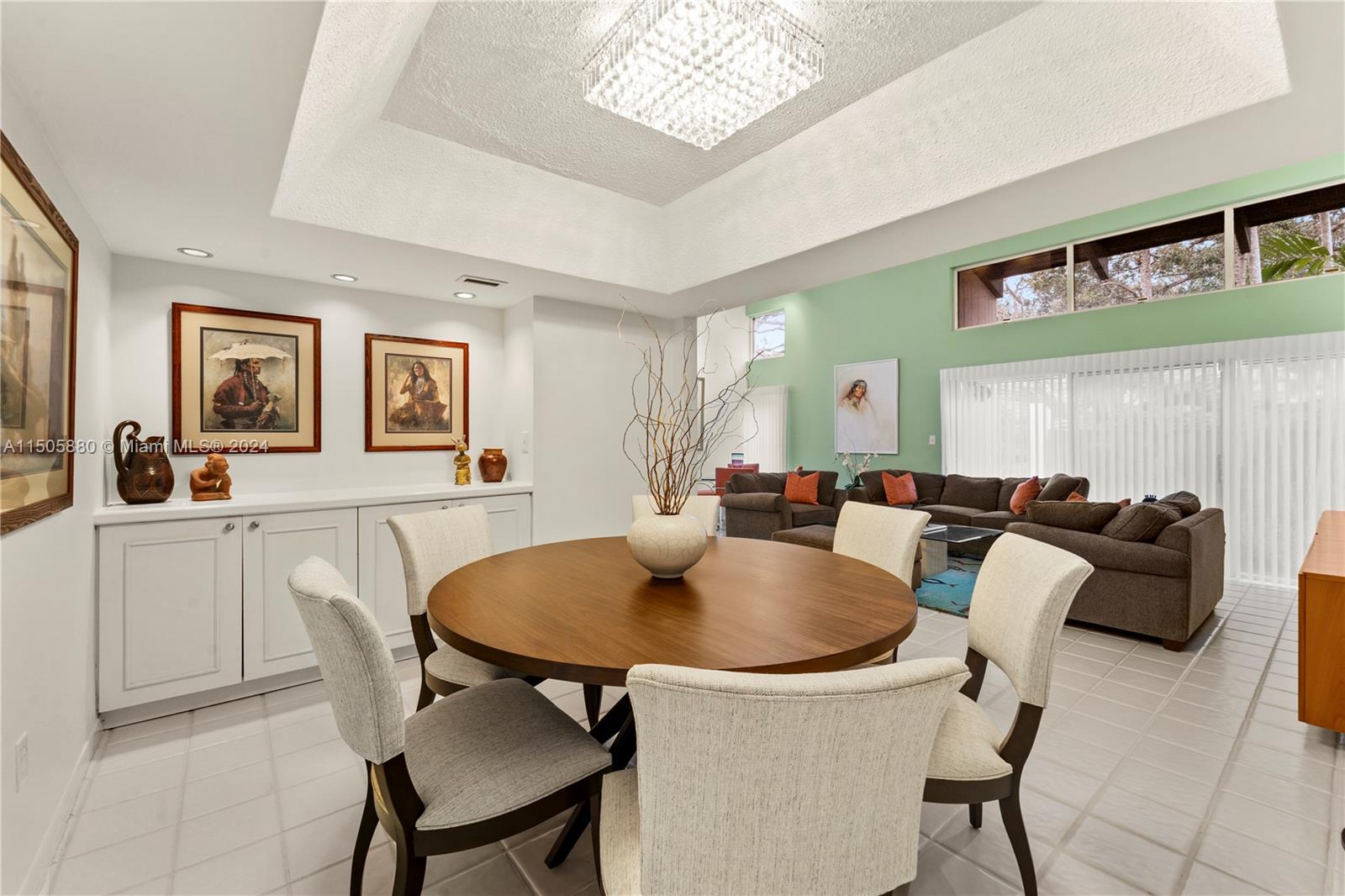 8636 Southwest 94th Street Miami, FL 33156 - Photo 6 of 29 a kitchen with a table chairs and a refrigerator