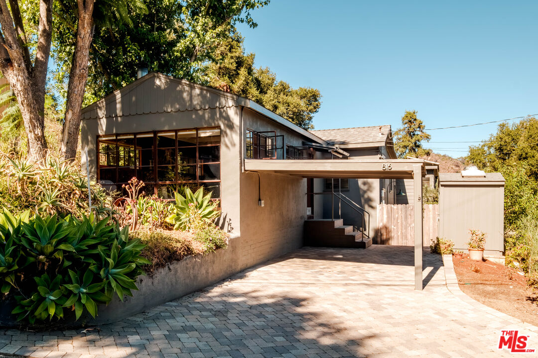 816 Basin Drive Topanga, CA 90290 - Photo 1 of 1 a front view of a house with a yard