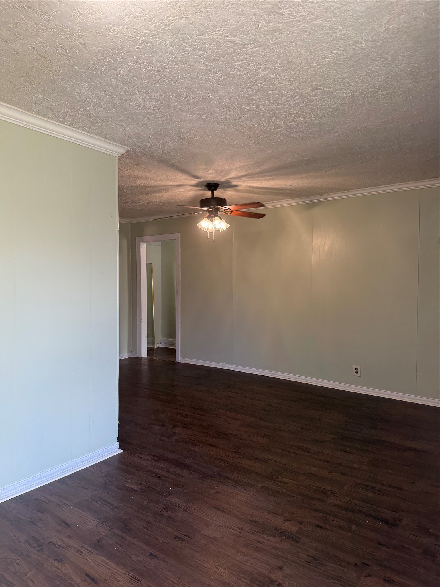 11914 Anchick Street Houston, TX 77076 - Photo 14 of 17 a view of an empty room with wooden floor