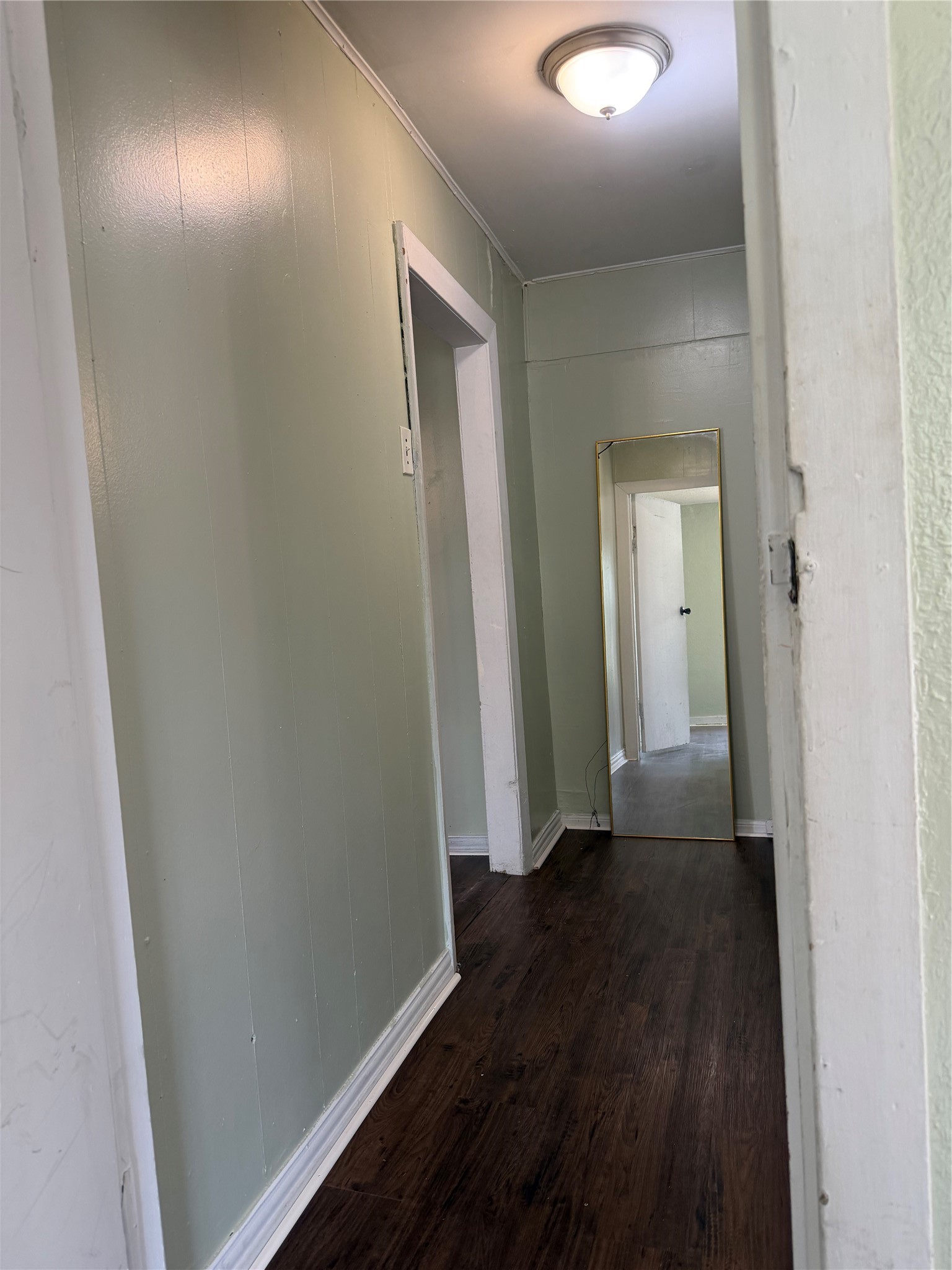 11914 Anchick Street Houston, TX 77076 - Photo 10 of 17 a view of hallway with wooden floor