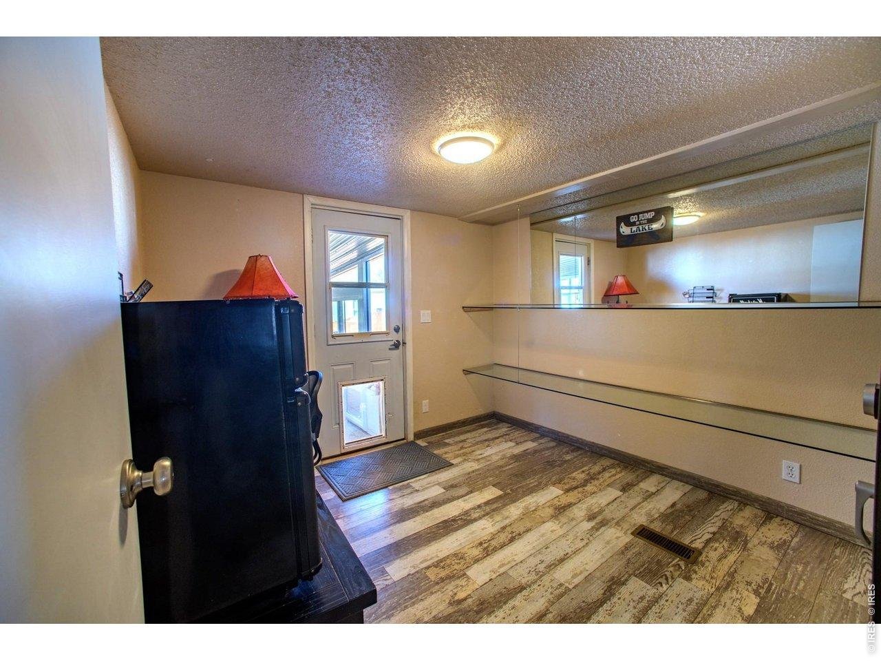 34 Arapaho Road Weldona, CO 80653 - Photo 27 of 48 Bedroom three with access to back patio