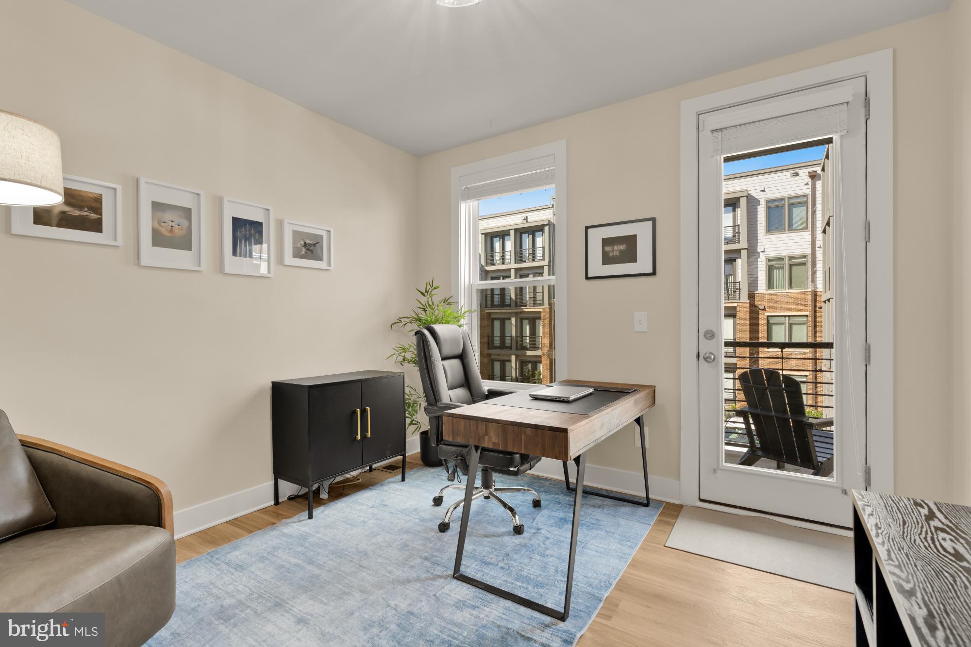 1704 Bandit Loop, Unit 20A Reston, VA 20190 - Photo 16 of 32 a view of a workspace with furniture and a window