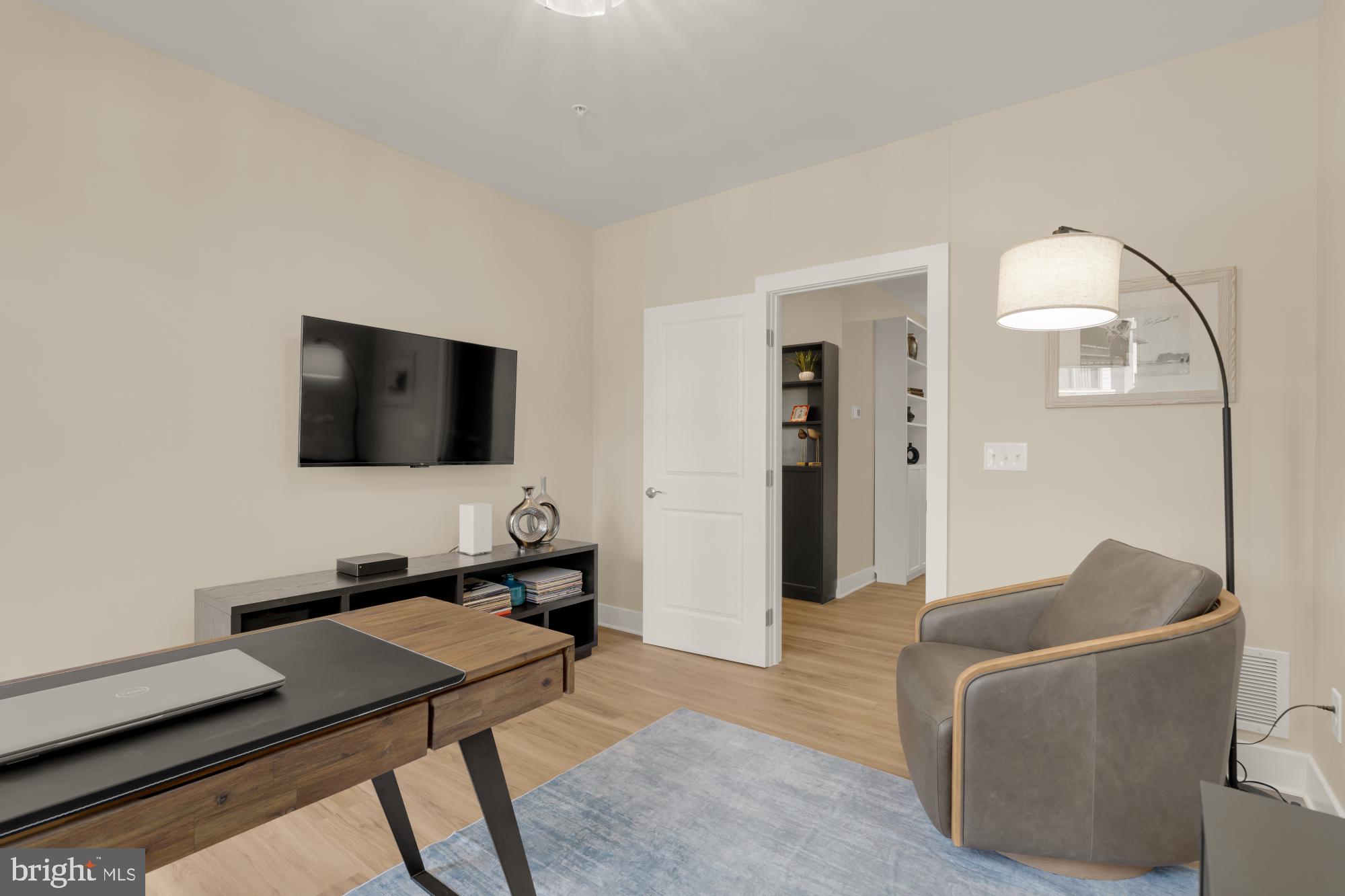 1704 Bandit Loop, Unit 20A Reston, VA 20190 - Photo 19 of 32 a living room with furniture and a flat screen tv