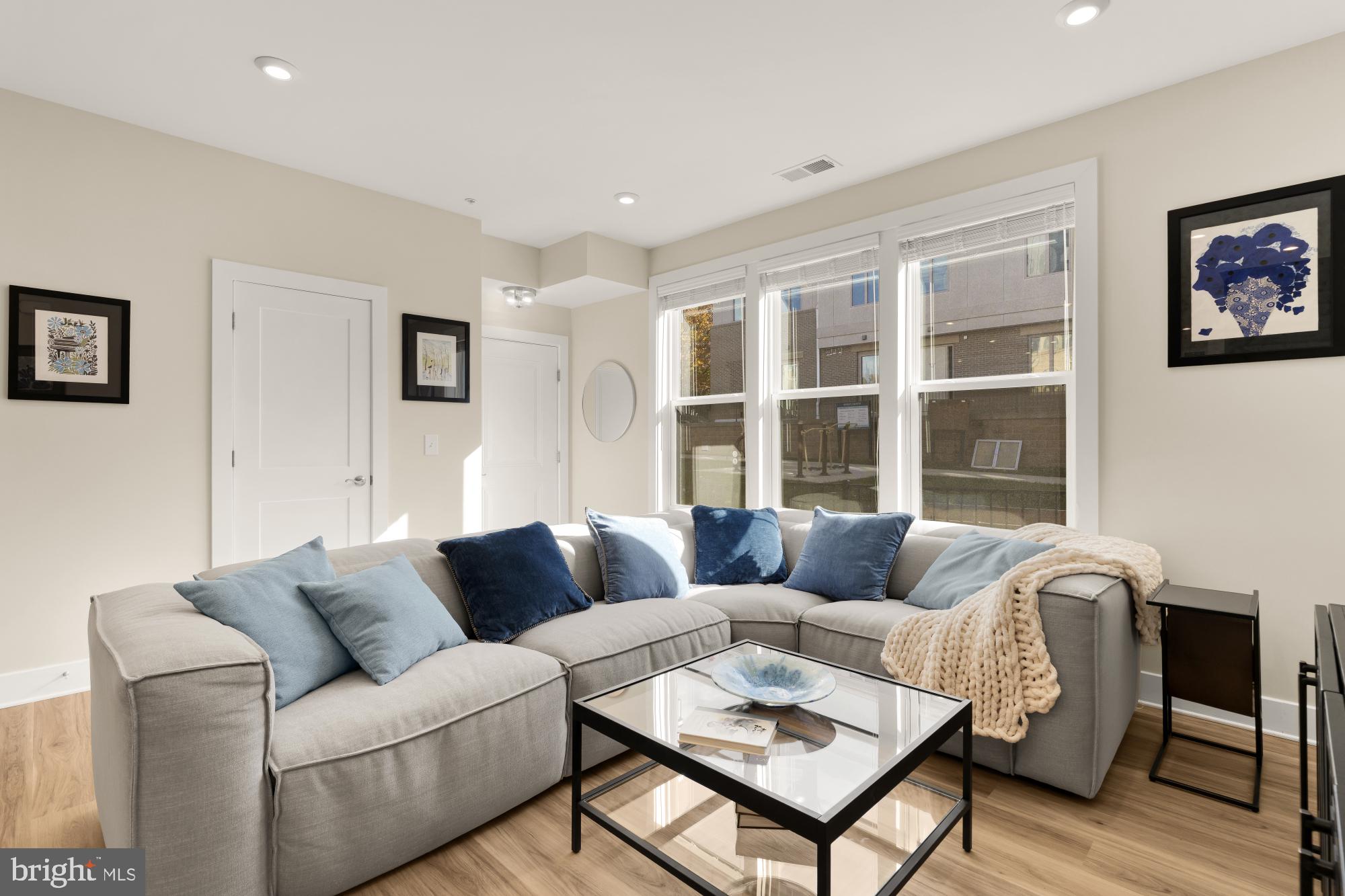 1704 Bandit Loop, Unit 20A Reston, VA 20190 - Photo 2 of 32 a living room with furniture and a large window
