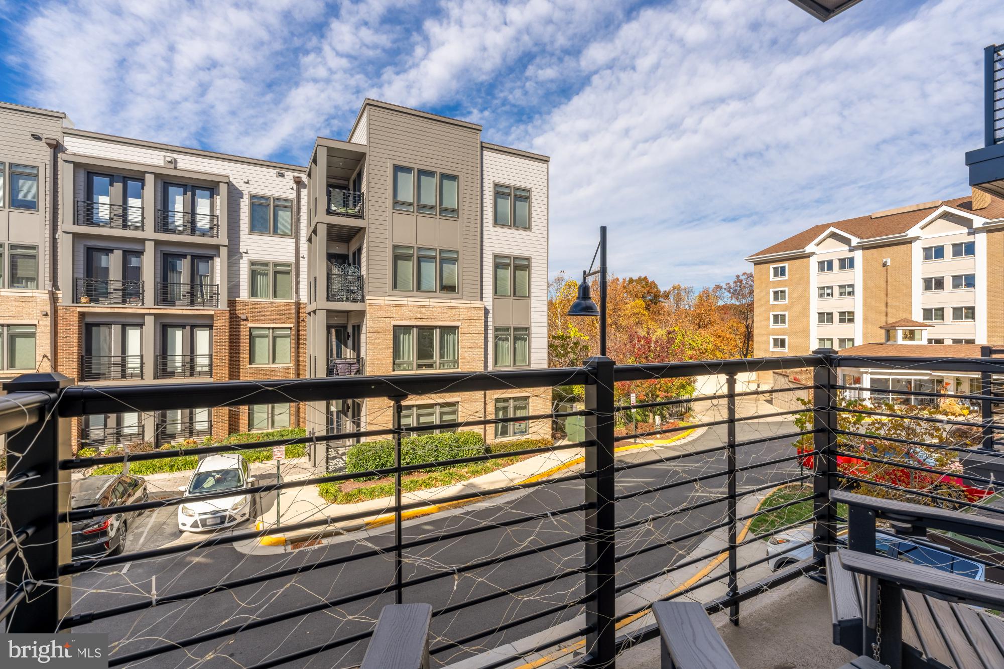 1704 Bandit Loop, Unit 20A Reston, VA 20190 - Photo 20 of 32 a view of a brick building from a balcony