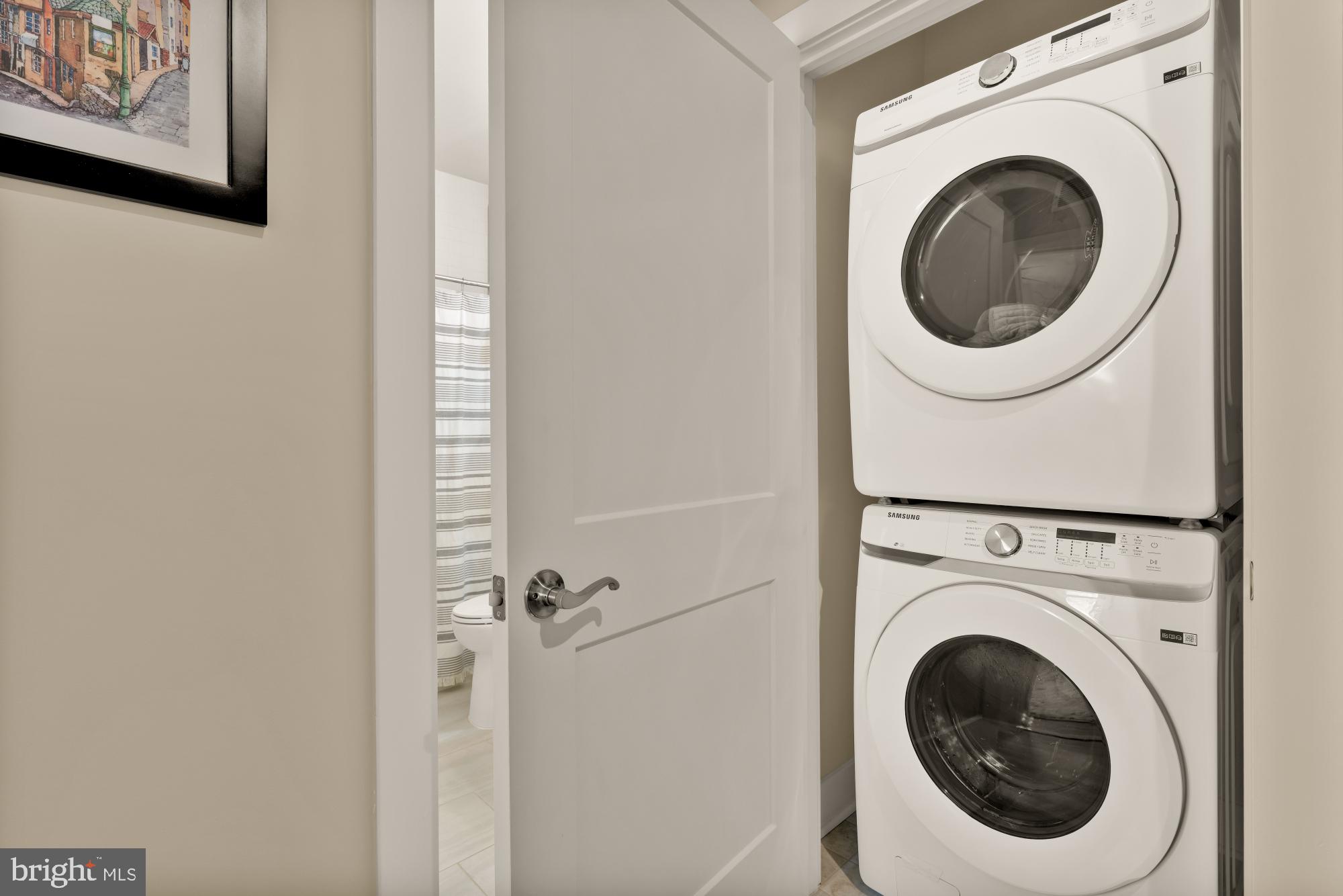 1704 Bandit Loop, Unit 20A Reston, VA 20190 - Photo 22 of 32 a utility room with dryer and washer