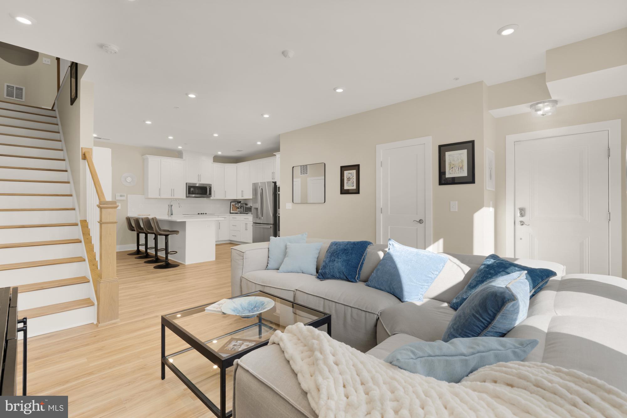 1704 Bandit Loop, Unit 20A Reston, VA 20190 - Photo 5 of 32 a living room with furniture and kitchen view