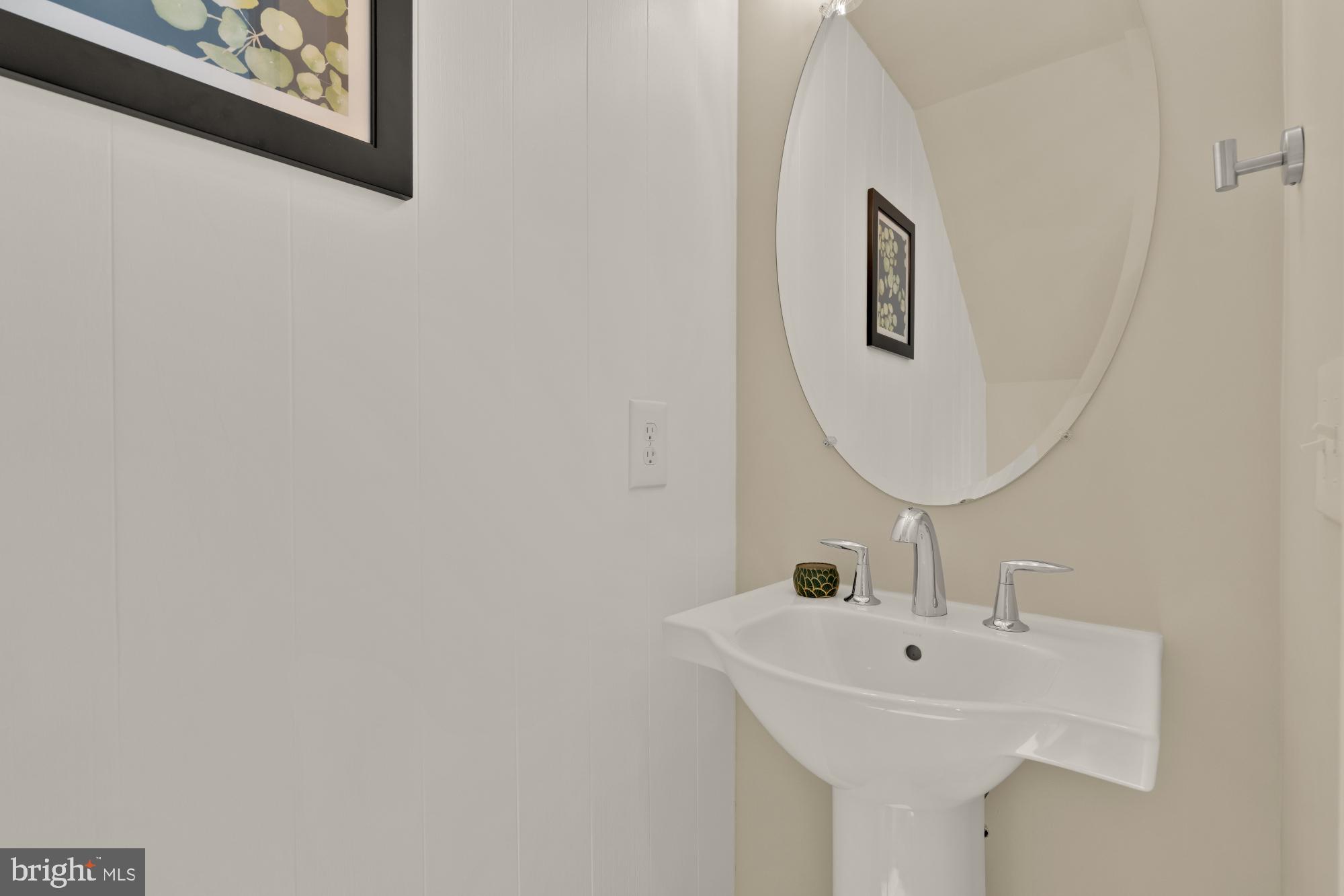 1704 Bandit Loop, Unit 20A Reston, VA 20190 - Photo 8 of 32 a bathroom with a sink and a mirror