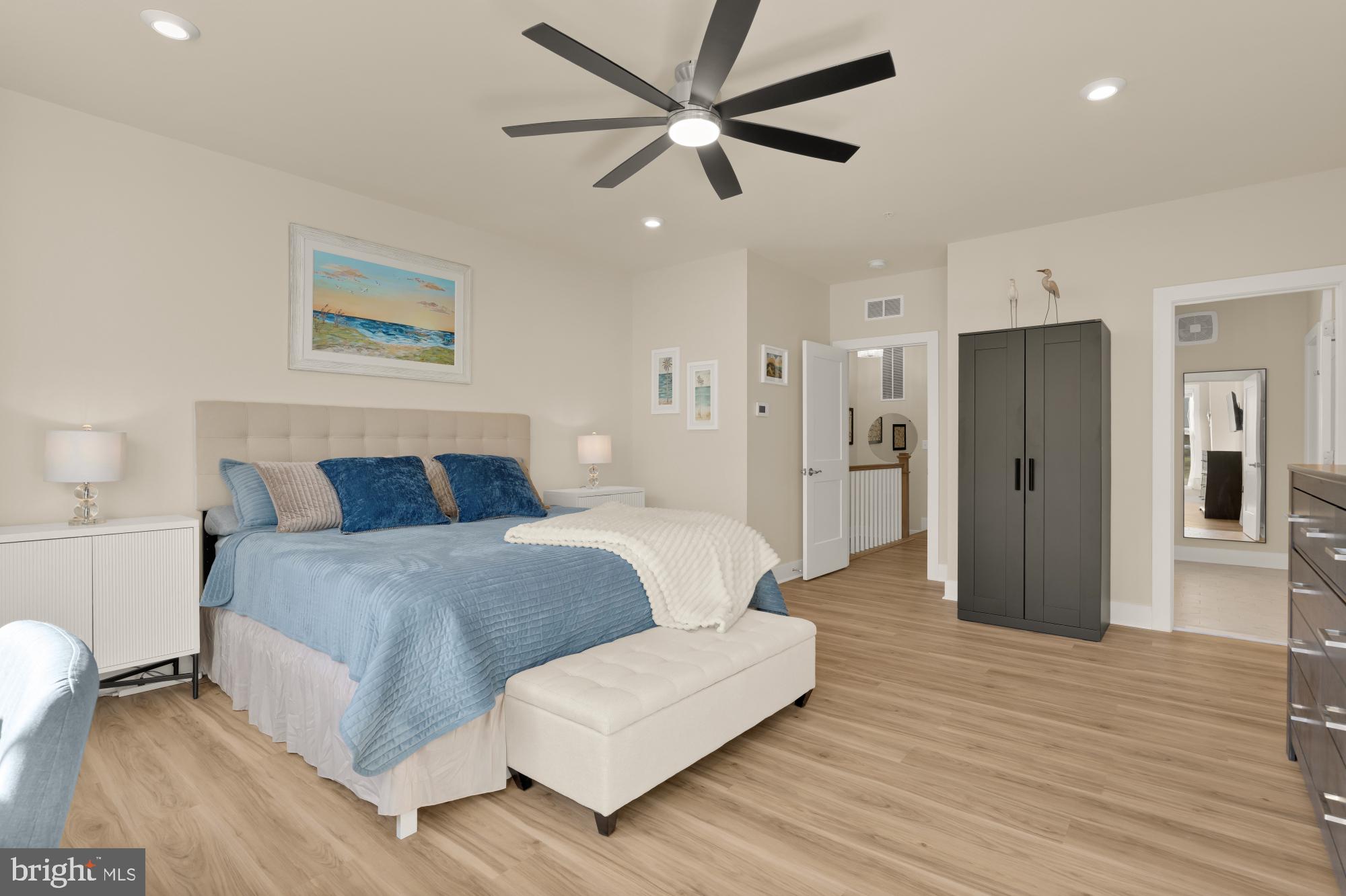 1704 Bandit Loop, Unit 20A Reston, VA 20190 - Photo 9 of 32 a spacious bedroom with a bed and a ceiling fan