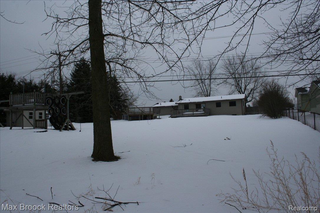 220 Middle Road Highland, MI 48357 - Photo 4 of 4 Rear view of home