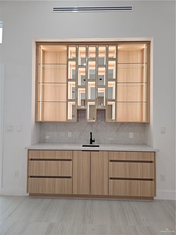 1821 South Middleton Street Edinburg, TX 78539 - Photo 9 of 26 a kitchen with a sink cabinets and a large window
