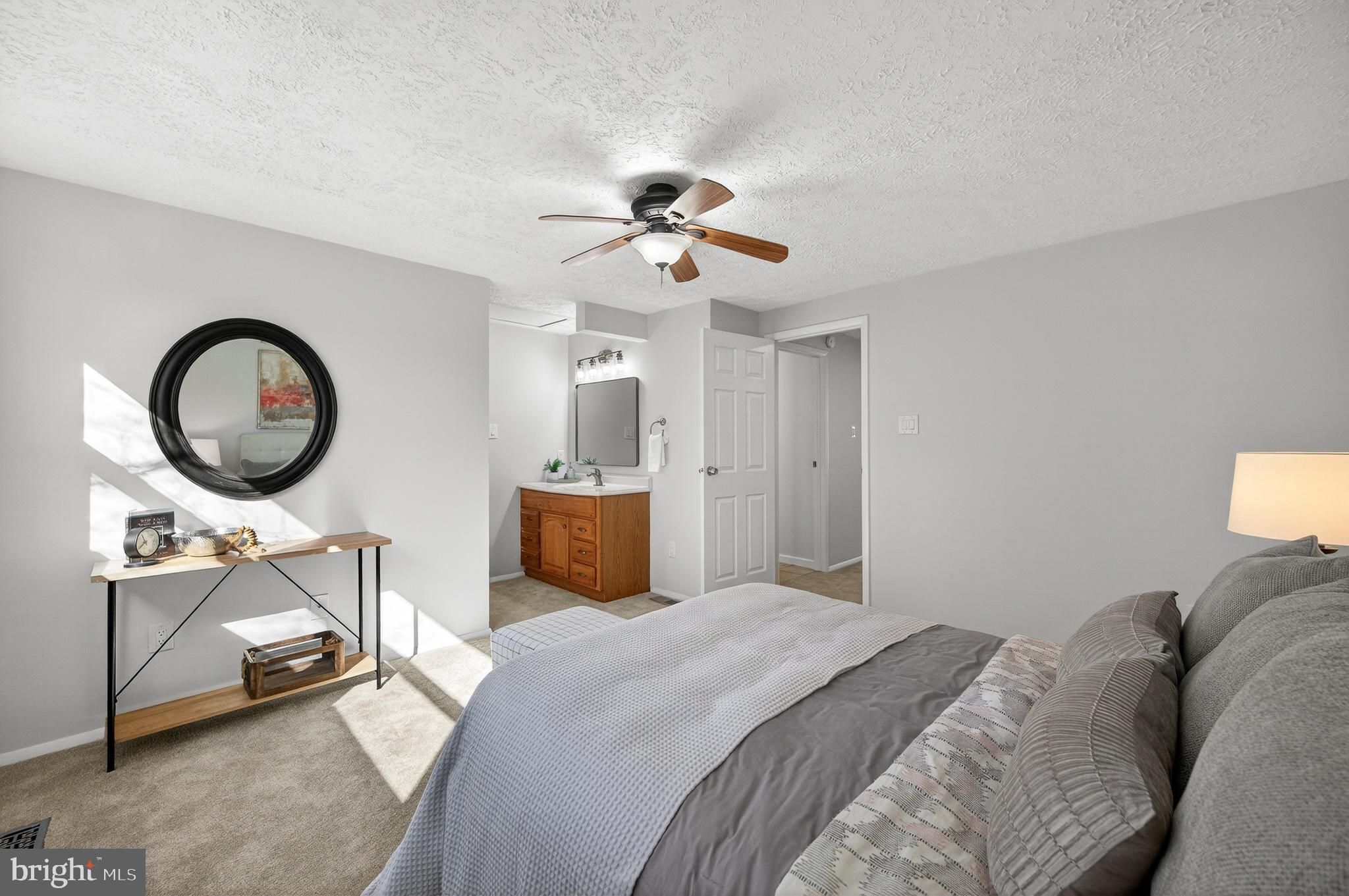 8225 Burning Forest Court Springfield, VA 22153 - Photo 19 of 43 a bedroom with a bed gym equipment and a chandelier