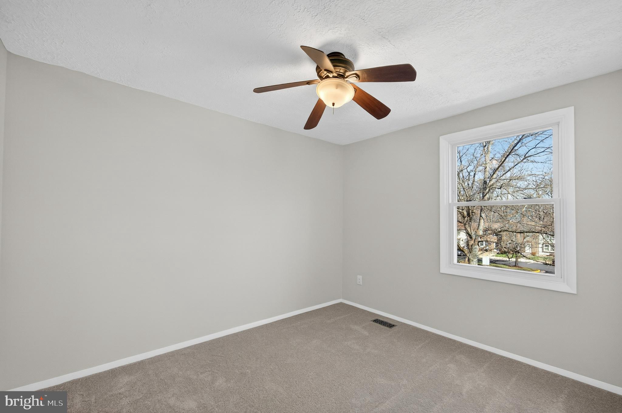 8225 Burning Forest Court Springfield, VA 22153 - Photo 22 of 43 a view of an empty room with a window