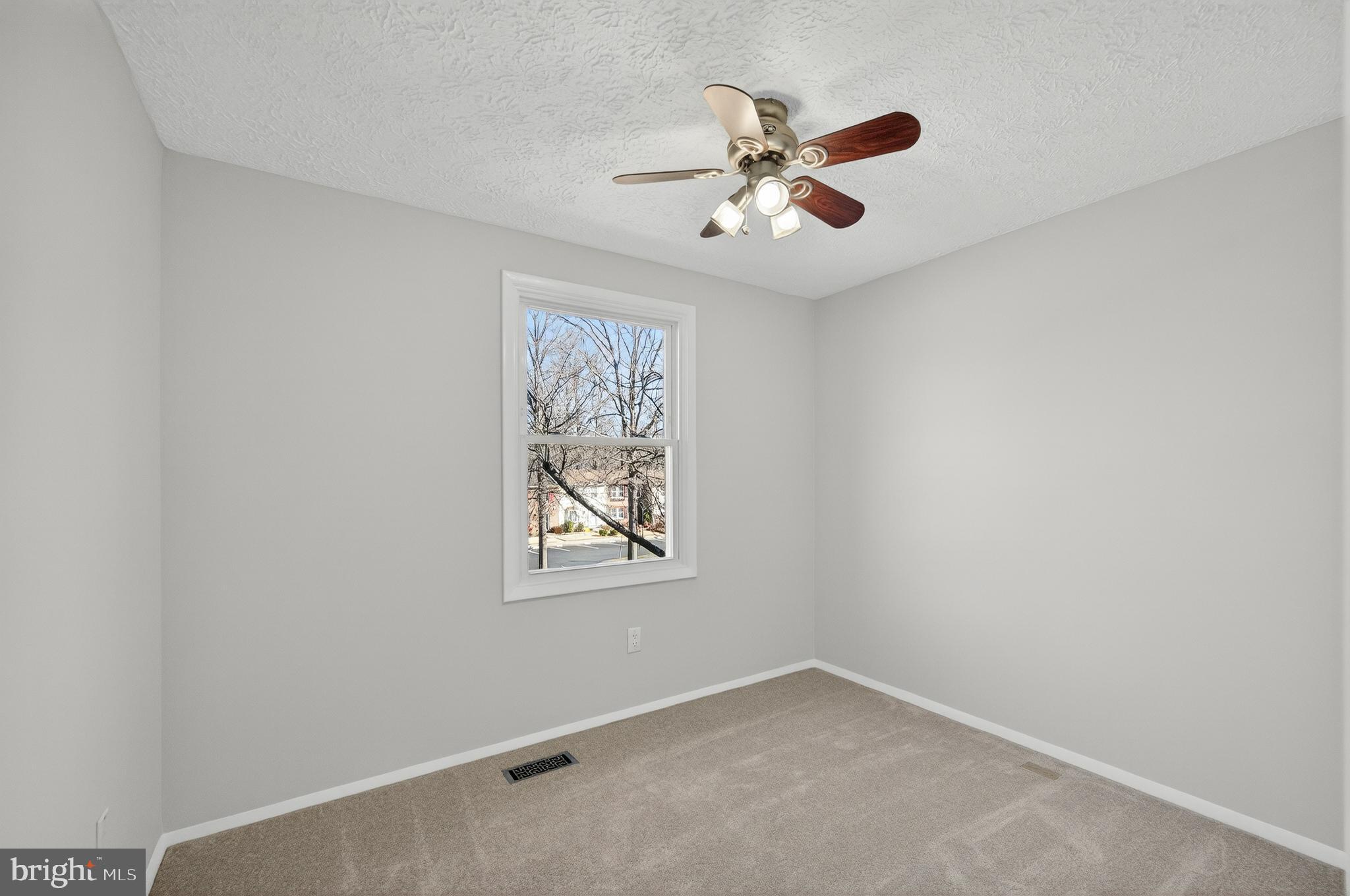 8225 Burning Forest Court Springfield, VA 22153 - Photo 24 of 43 an empty room with window and fan