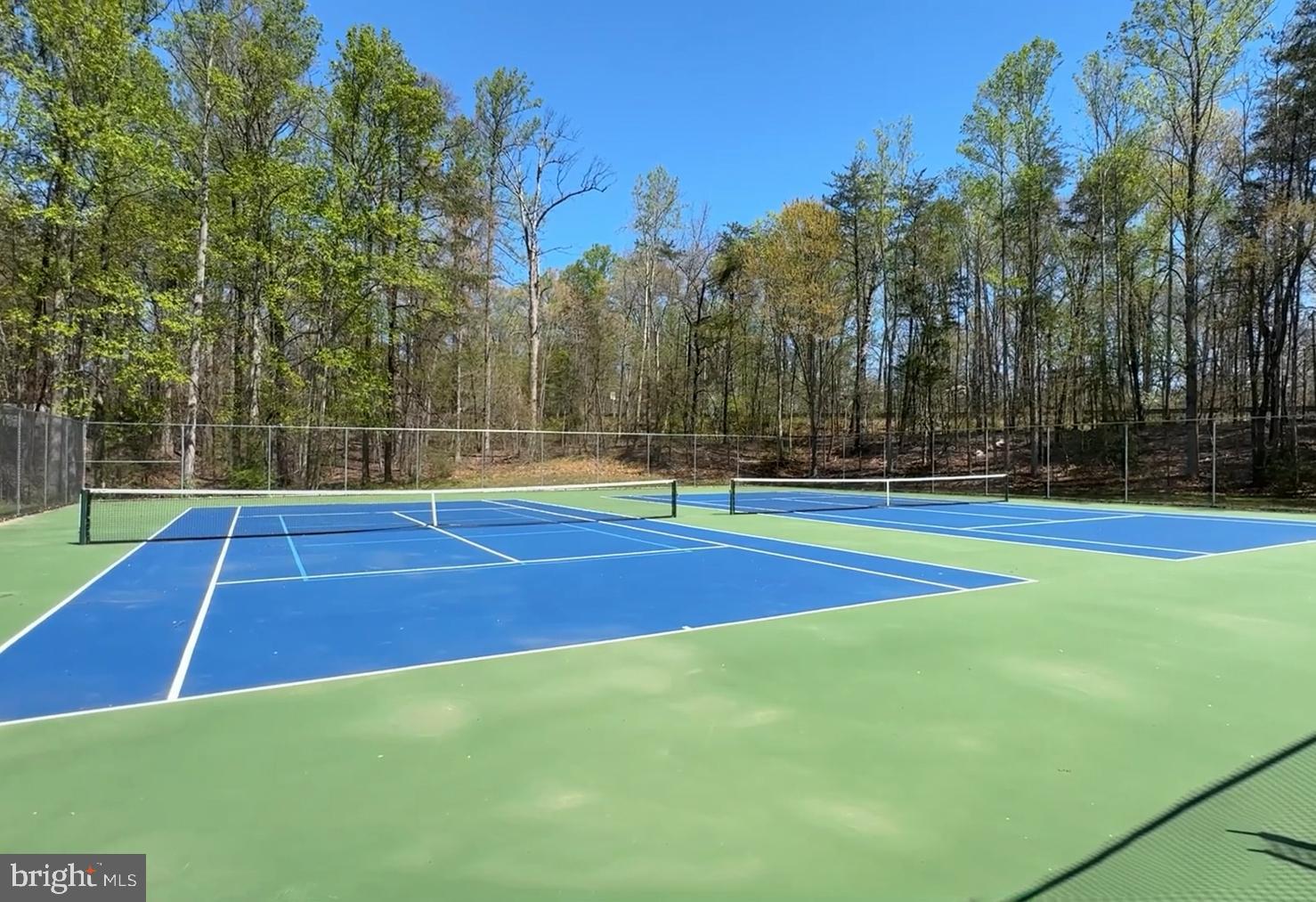 8225 Burning Forest Court Springfield, VA 22153 - Photo 37 of 43 a view of a tennis court