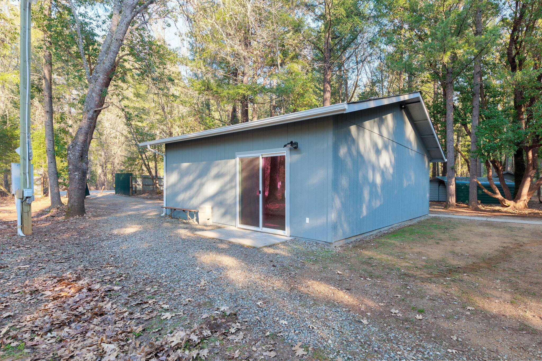 201 Kirkham Road Cave Junction, OR 97523 - Photo 41 of 55 Garage/glass door to studio room in garage