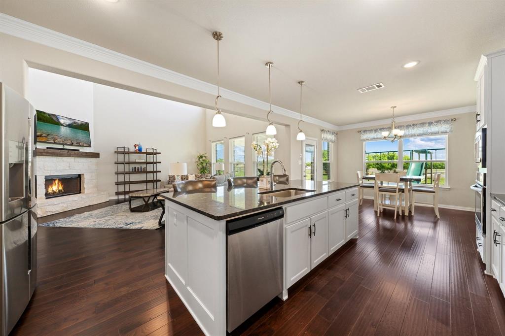12700 Cold Spring Lane Ponder, TX 76259 - Photo 11 of 30 The kitchen features an eat-in kitchen with room for barstools.