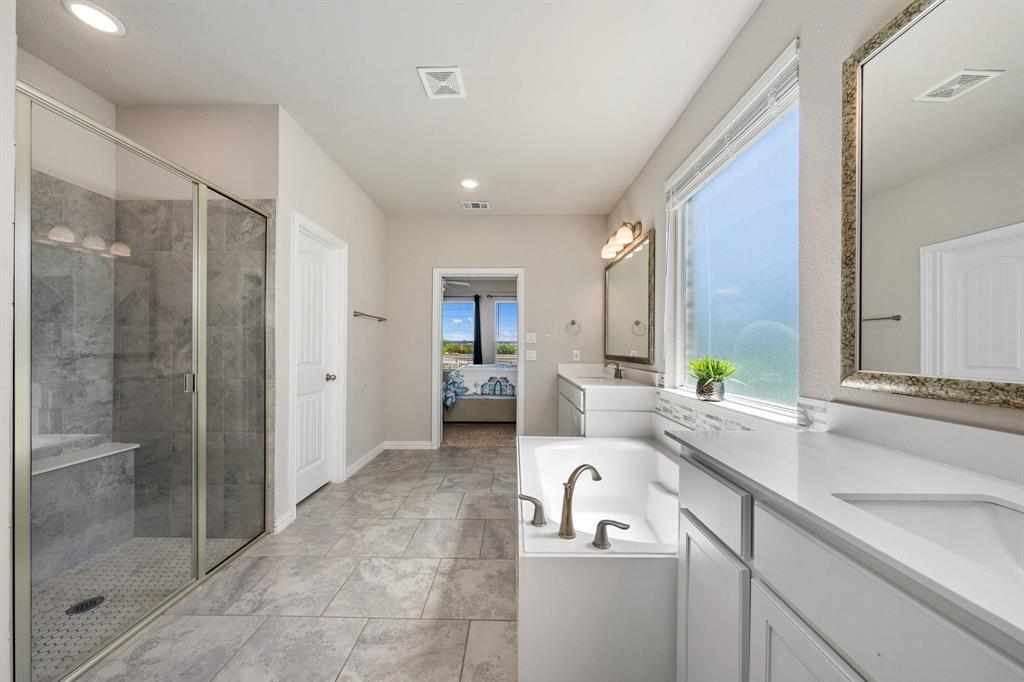 12700 Cold Spring Lane Ponder, TX 76259 - Photo 16 of 30 Modern Master bath with a large walk-in closet.