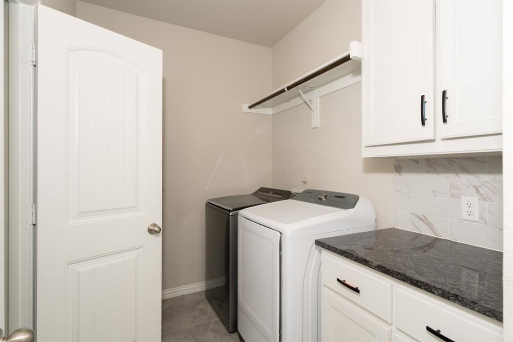12700 Cold Spring Lane Ponder, TX 76259 - Photo 23 of 30 The Utility room has direct access to the Master closet for easy access.
