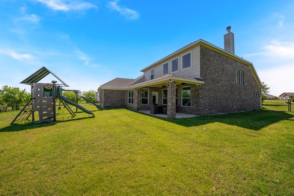 12700 Cold Spring Lane Ponder, TX 76259 - Photo 24 of 30 Covered patio overlooks expansive backyard.