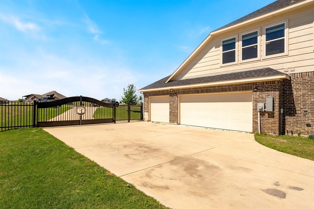 12700 Cold Spring Lane Ponder, TX 76259 - Photo 29 of 30 Oversized 3-car garage with extra parking pad.