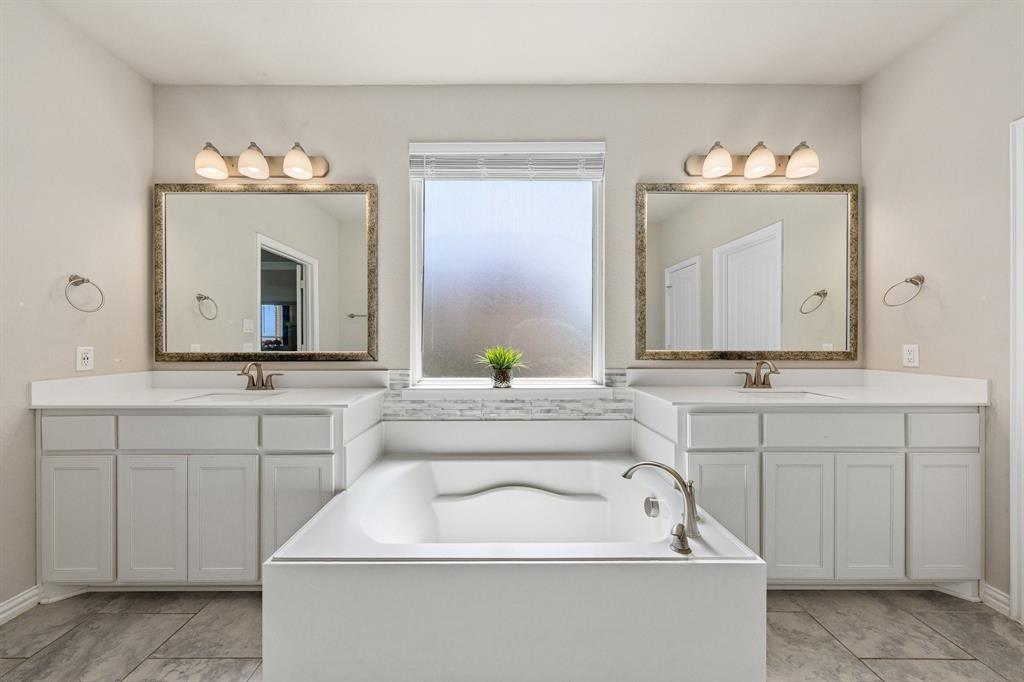 12700 Cold Spring Lane Ponder, TX 76259 - Photo 6 of 30 Soaking tub and dual vanities in the primary bath.