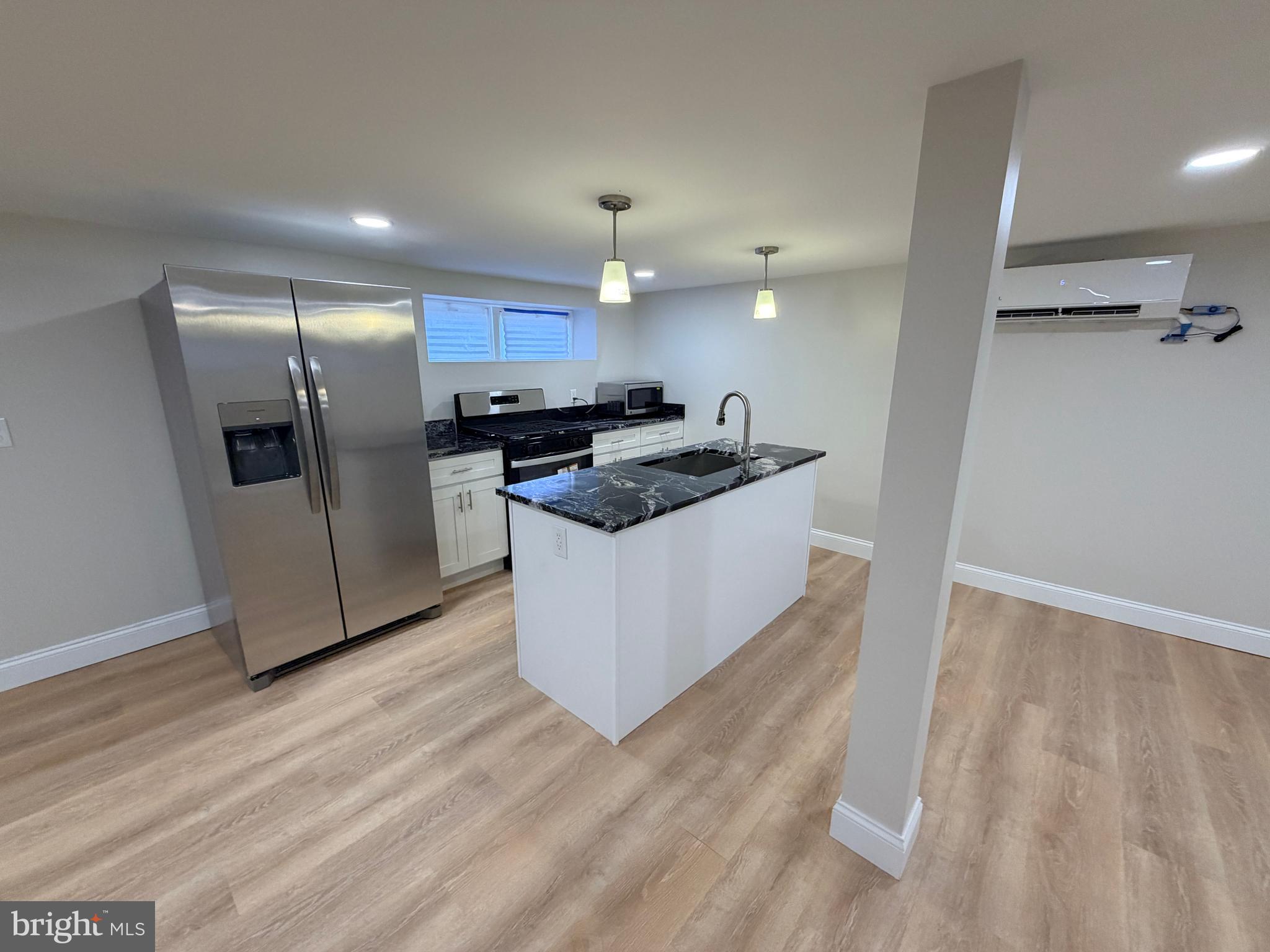 3 East Overlea Avenue, Unit 3 Baltimore, MD 21206 - Photo 13 of 45 a kitchen with stainless steel appliances granite countertop a stove a refrigerator and a sink