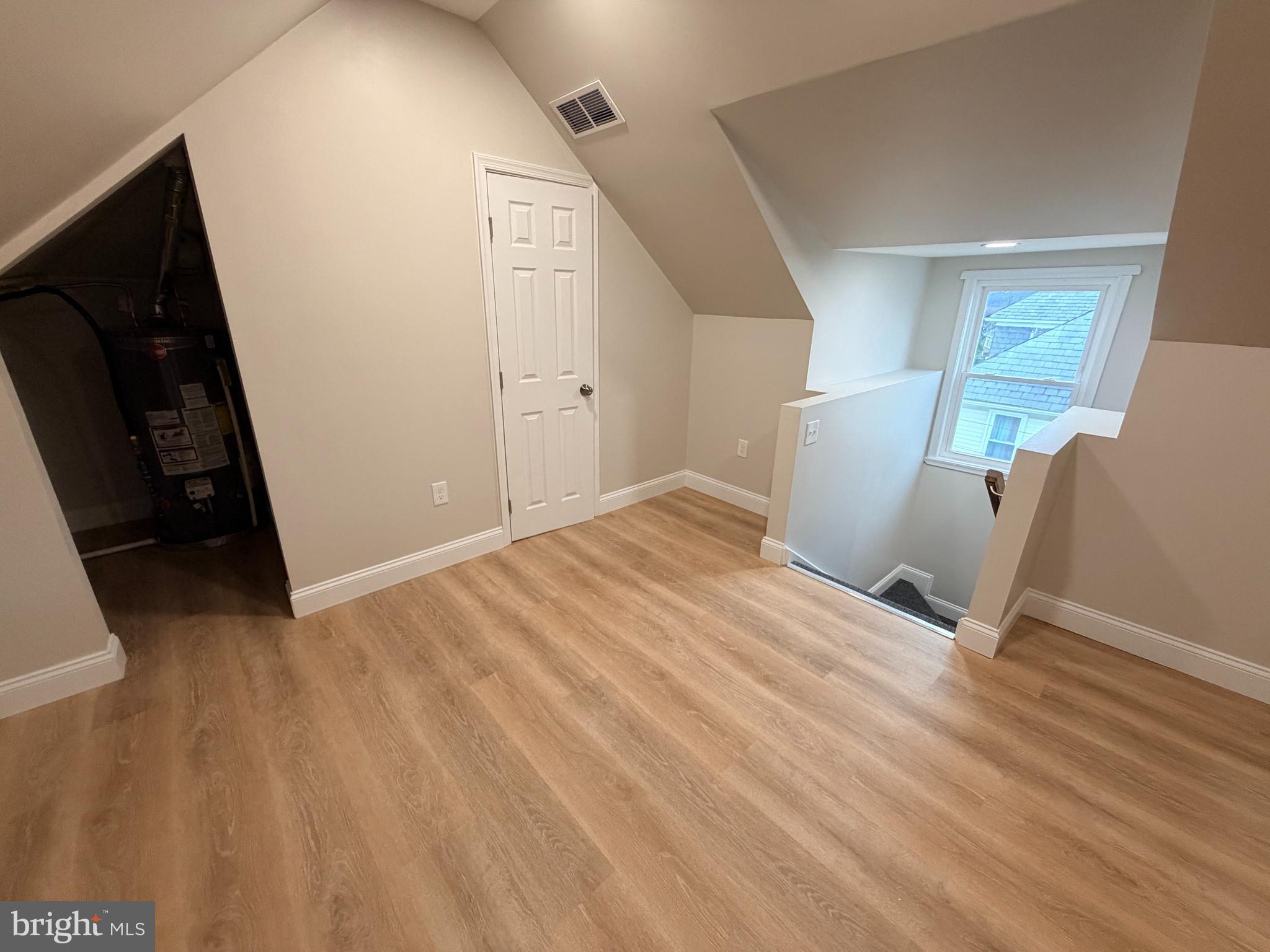 3 East Overlea Avenue, Unit 3 Baltimore, MD 21206 - Photo 35 of 45 a view of empty room with wooden floor