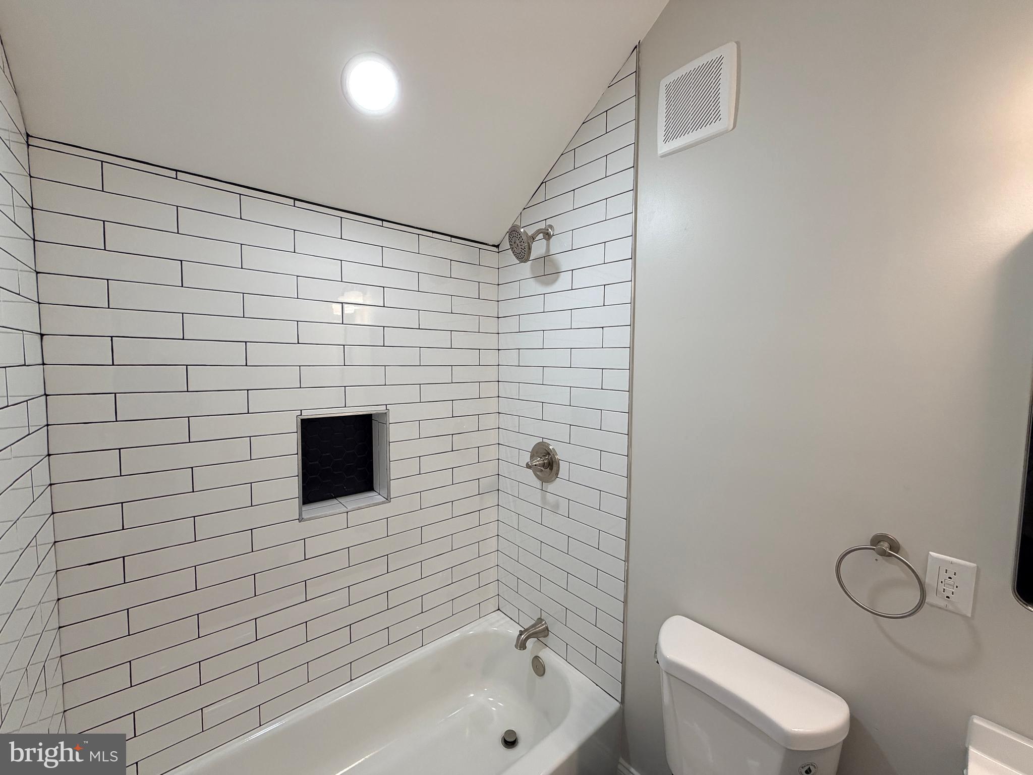 3 East Overlea Avenue, Unit 3 Baltimore, MD 21206 - Photo 40 of 45 a bathroom with a toilet a sink and mirror